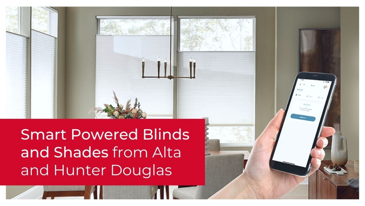 A person holding up their phone to power their shades and blinds